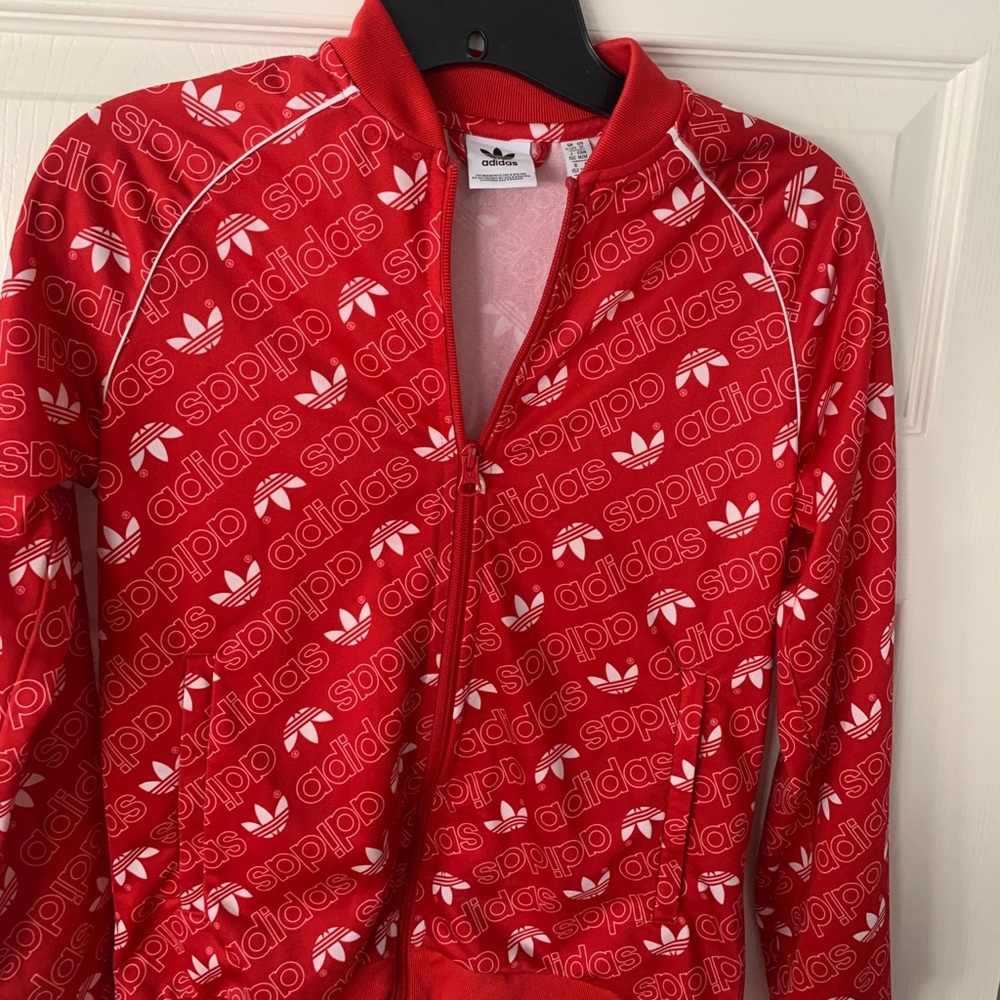 Red Adidas track jacket and pants, youth size Medium.